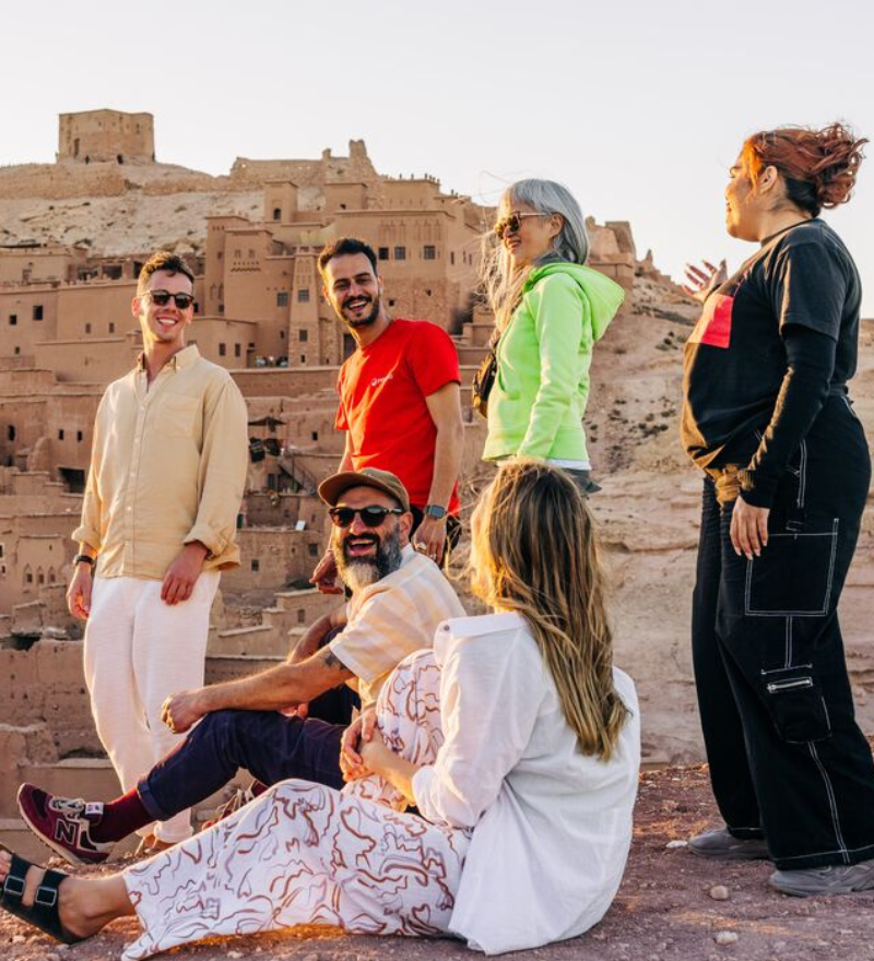 Private Morocco tours exploring the Sahara Desert dunes at sunset