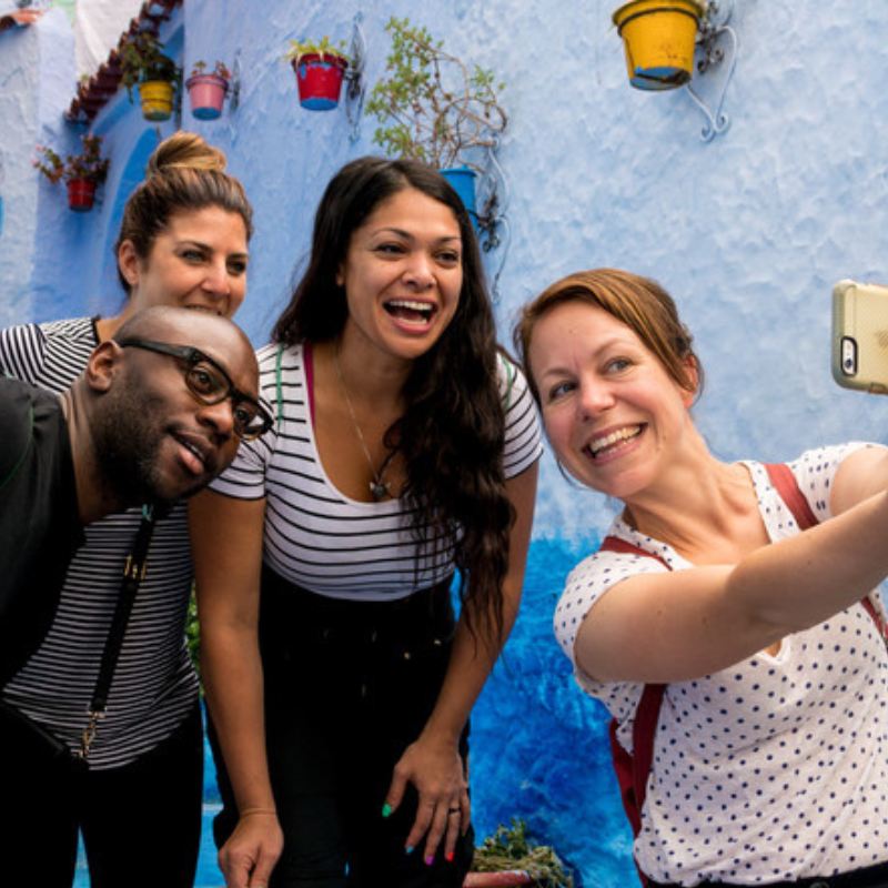 Local guide from our private Morocco tour company leading travelers in Marrakech